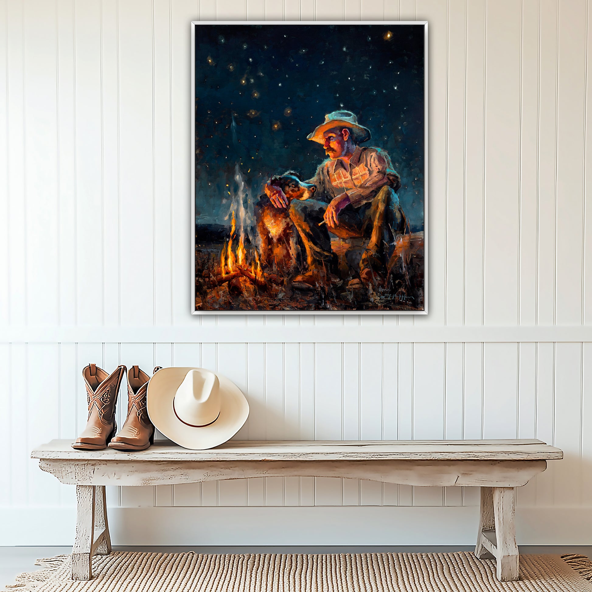 Cowboy art canvas print wall art available in multiple sizes and frame options. From original painting by Jerry Markham of a cowboy with his dog by campfire at night under starry sky with big dipper and north star. This western wall art shown in white frame.